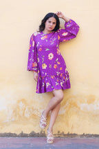 Tiered short dress with flounce sleeves.