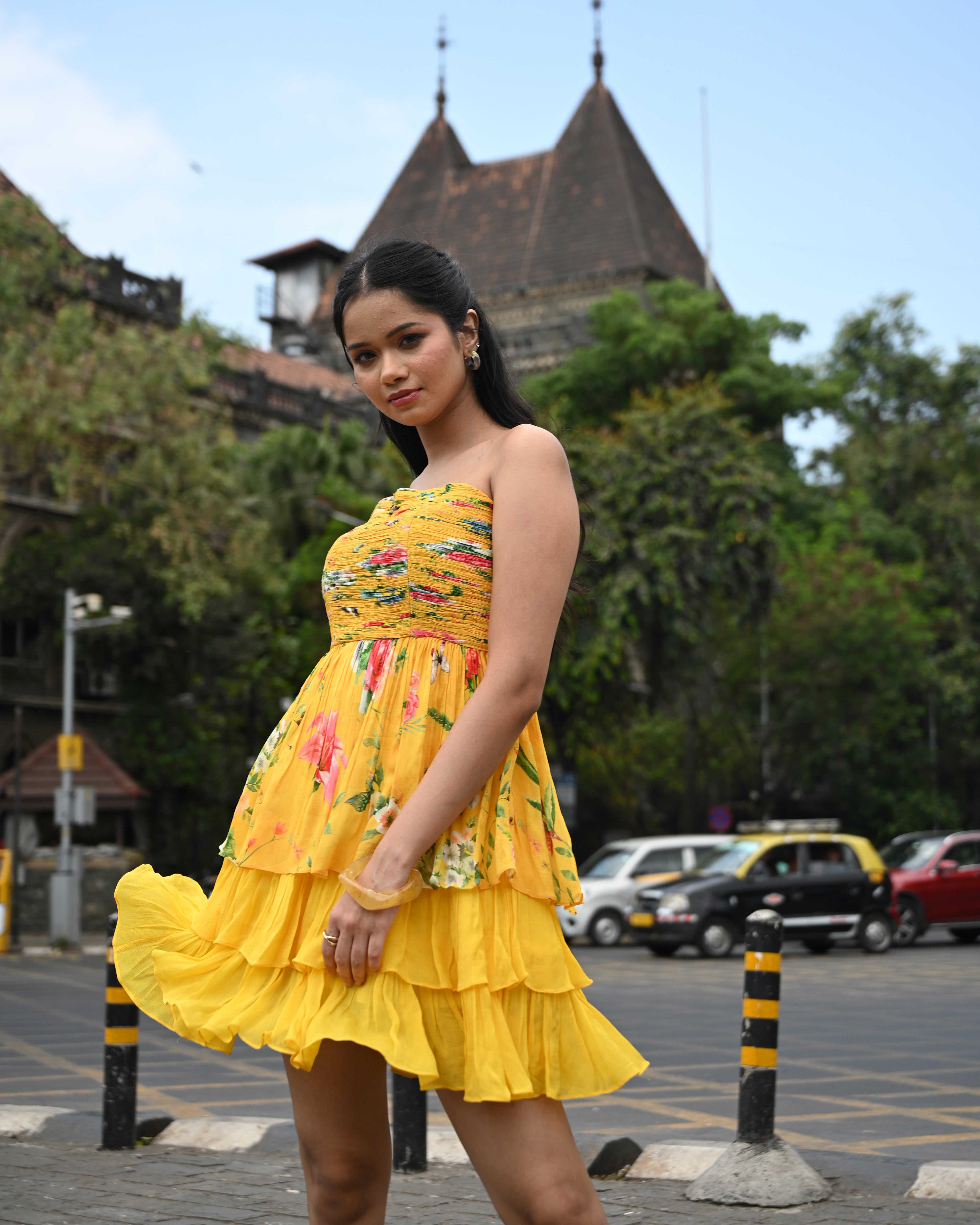 Simor Golden Hour tube layered short dress displayed on hanger, showcasing its stylish design and vibrant golden color.