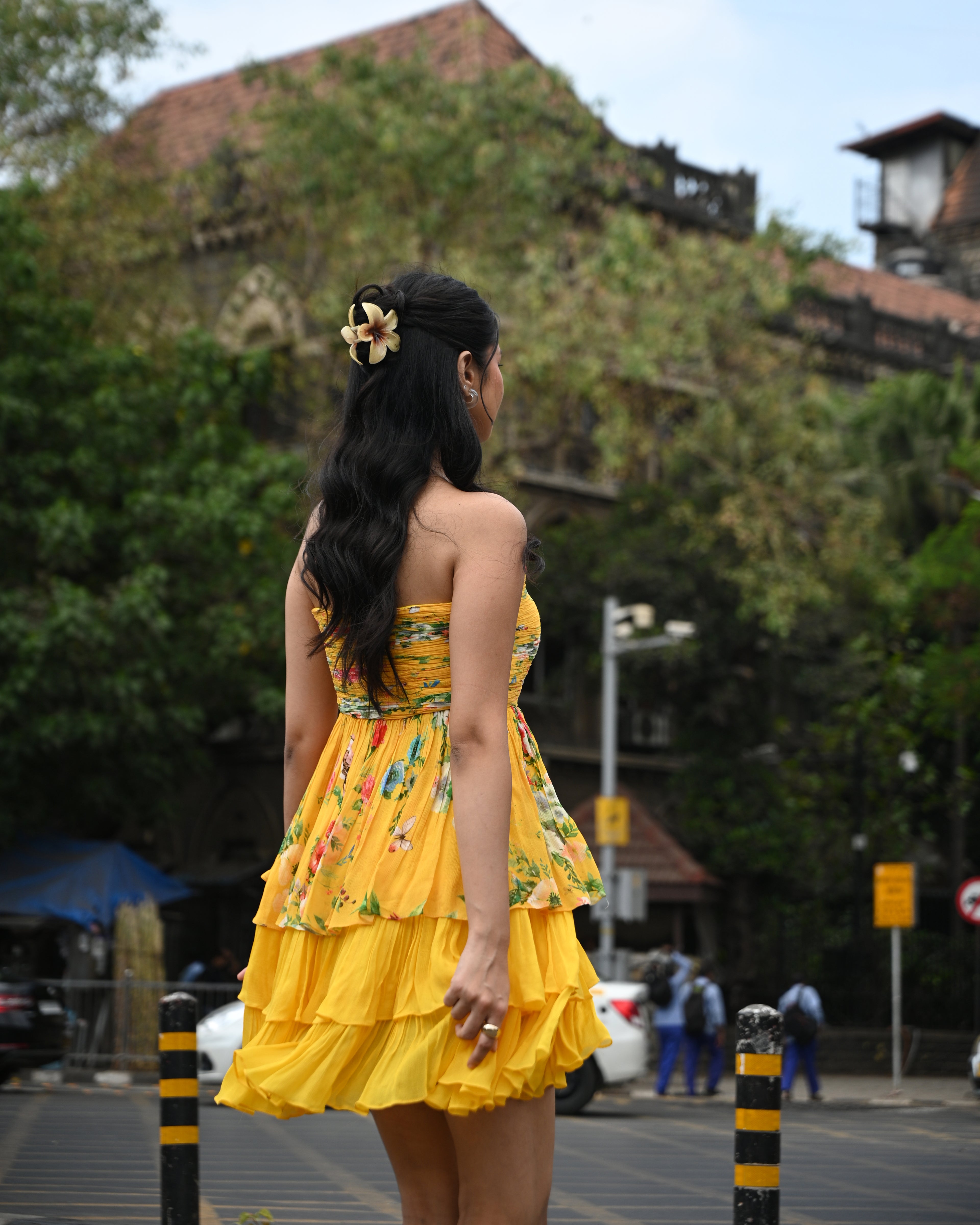 Simor Golden Hour tube layered short dress displayed on a hanger, showcasing its stylish design and vibrant color.