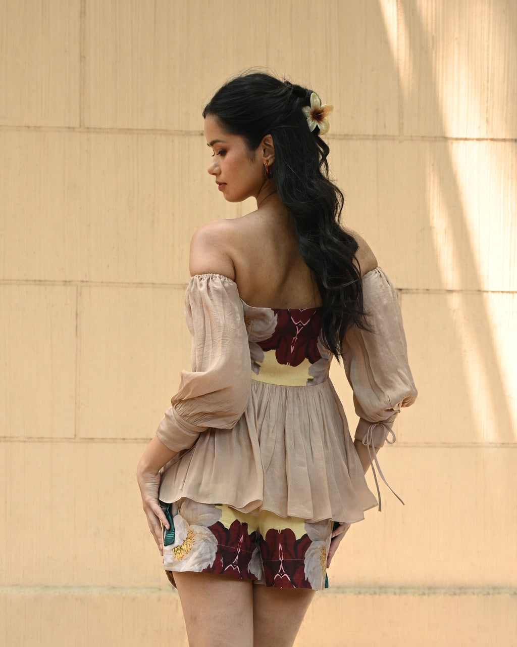 Simor Floral Whisper peplum top and skort coord set, featuring a floral pattern, fitted bodice, and stylish matching shorts.