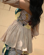 Simor Floral Whisper peplum top and skort coord set, featuring a floral pattern and stylish design, shown on a model.