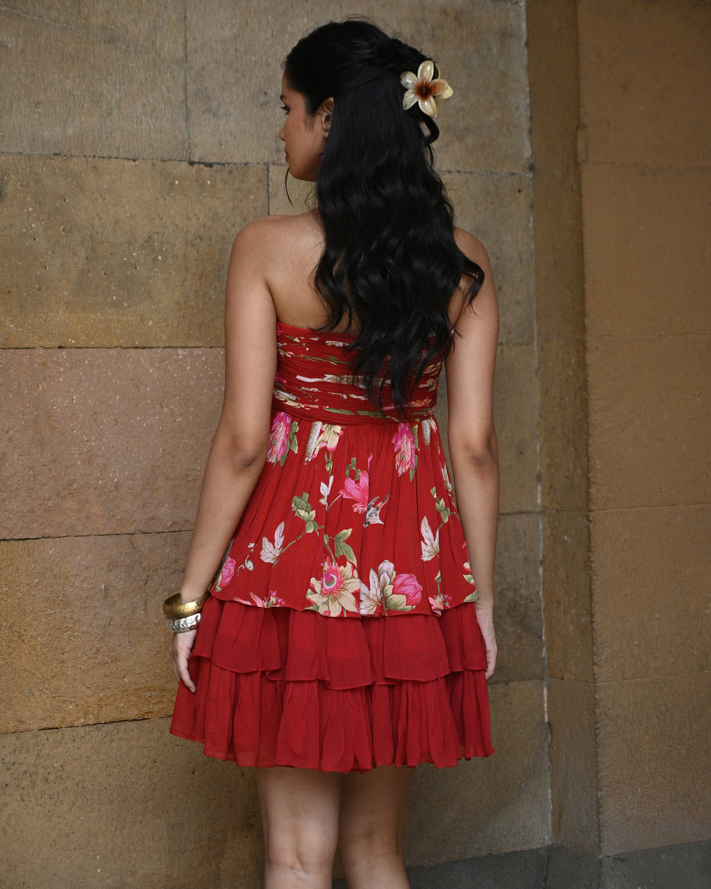 Red layered tube dress by Simor, featuring a short, stylish design with elegant fabric and a fitted silhouette.