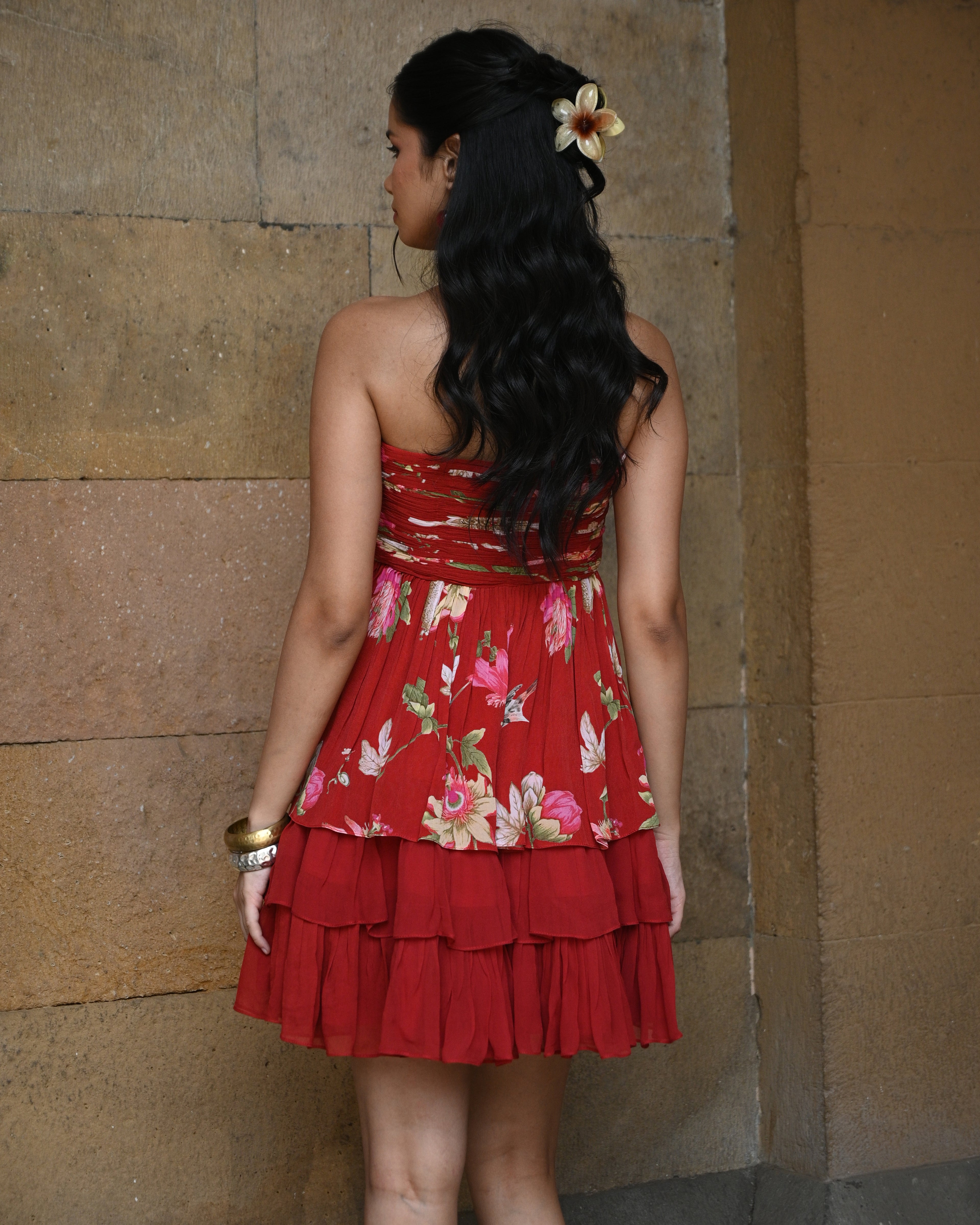 Red layered tube dress by Simor, featuring a short, stylish design with elegant fabric and a fitted silhouette.