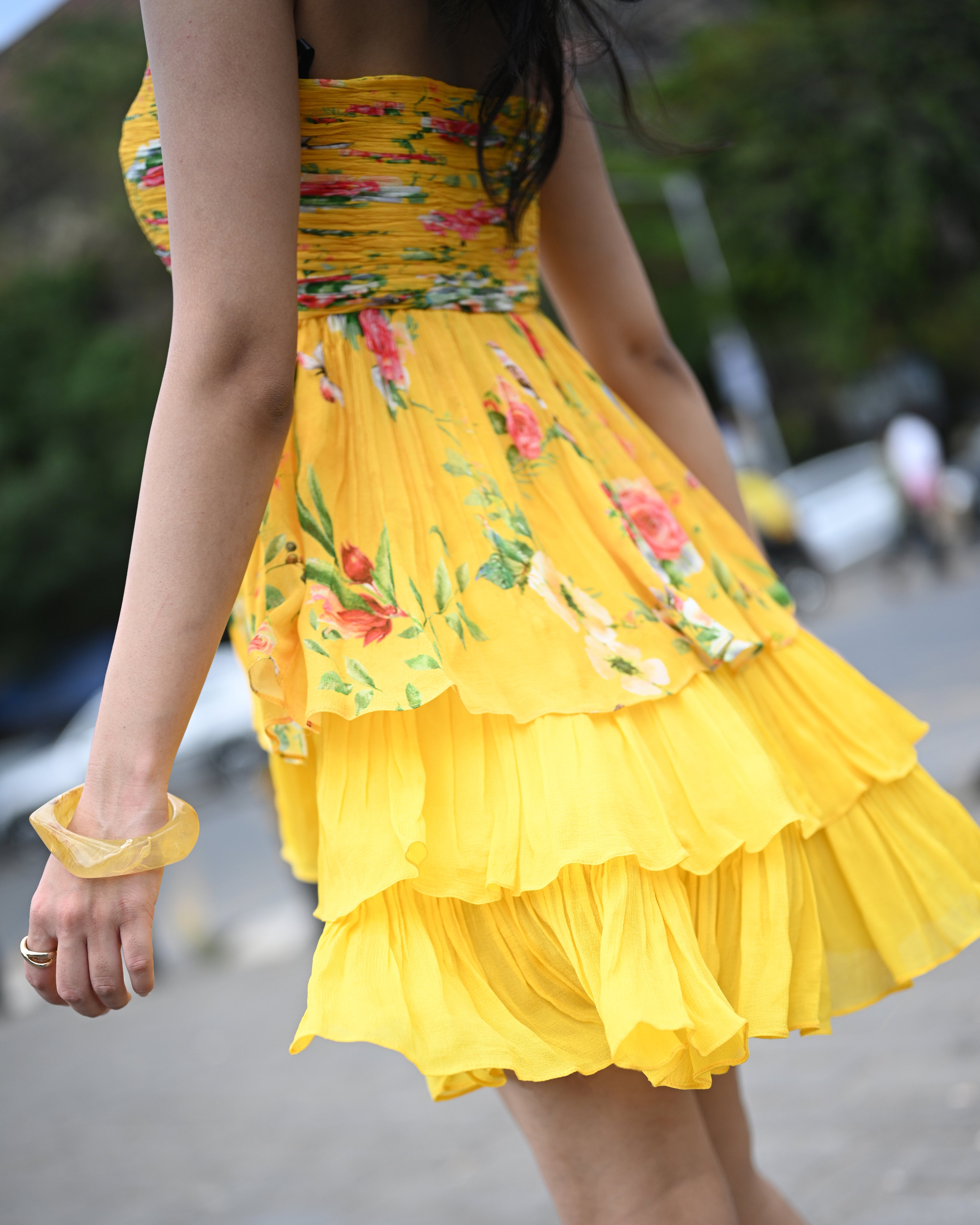 Simor Golden Hour tube layered short dress displayed on a hanger, showcasing its stylish design and vibrant color.