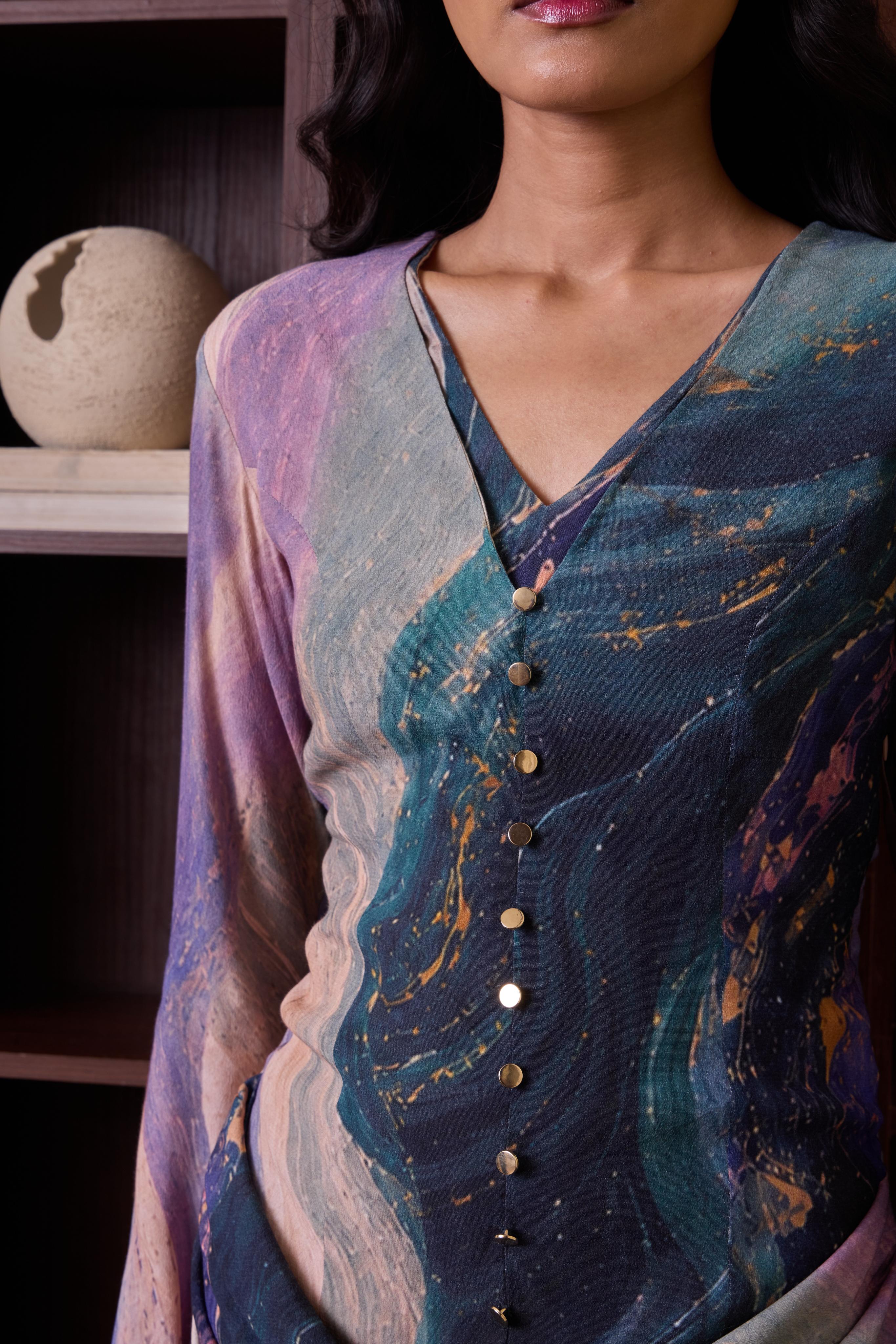 Cosmic short dress with long sleeves by Simor, featuring a draped design and stylish silhouette.