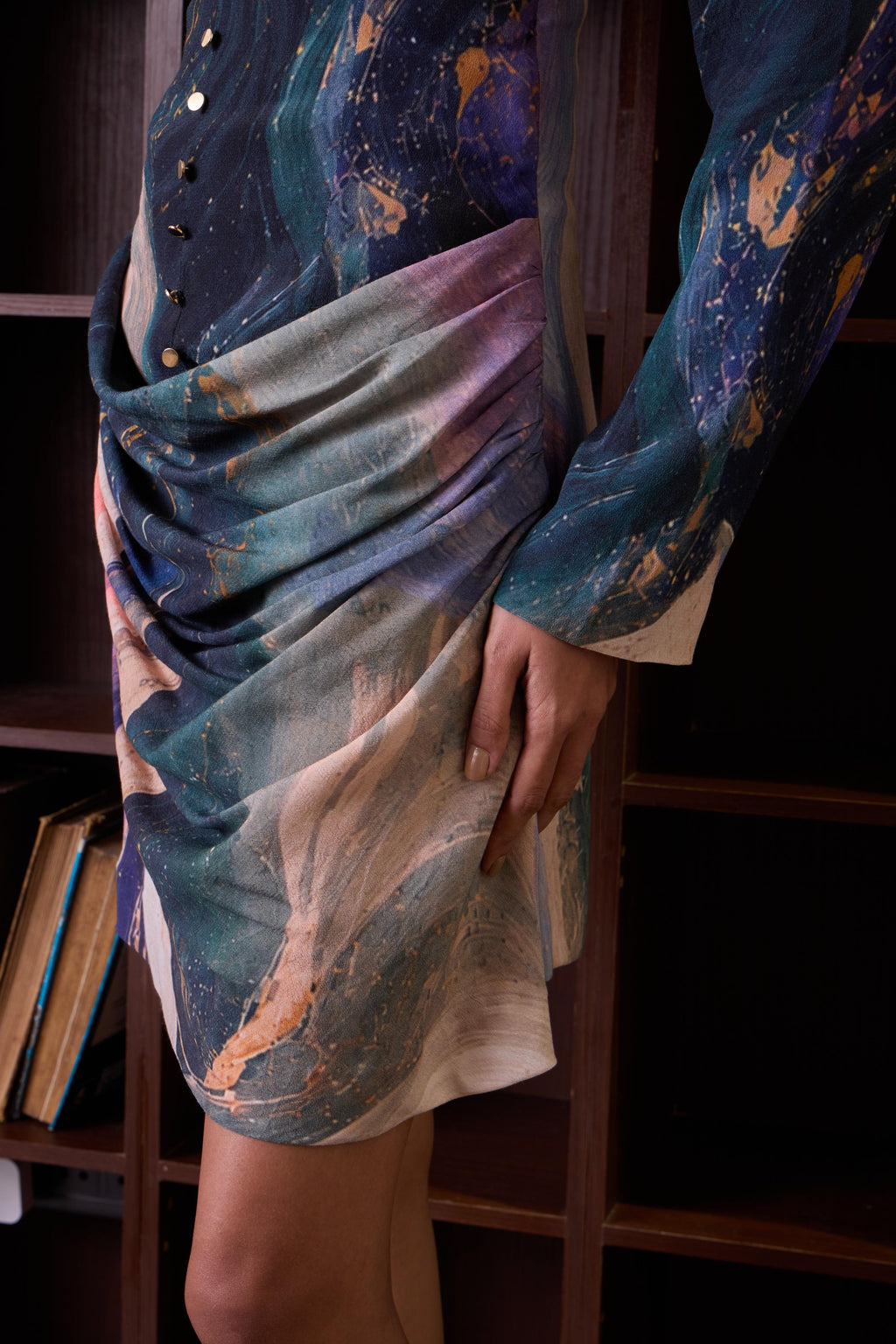 Cosmic short dress with long sleeves by Simor, featuring draped design and stylish fit, perfect for chic evening wear.