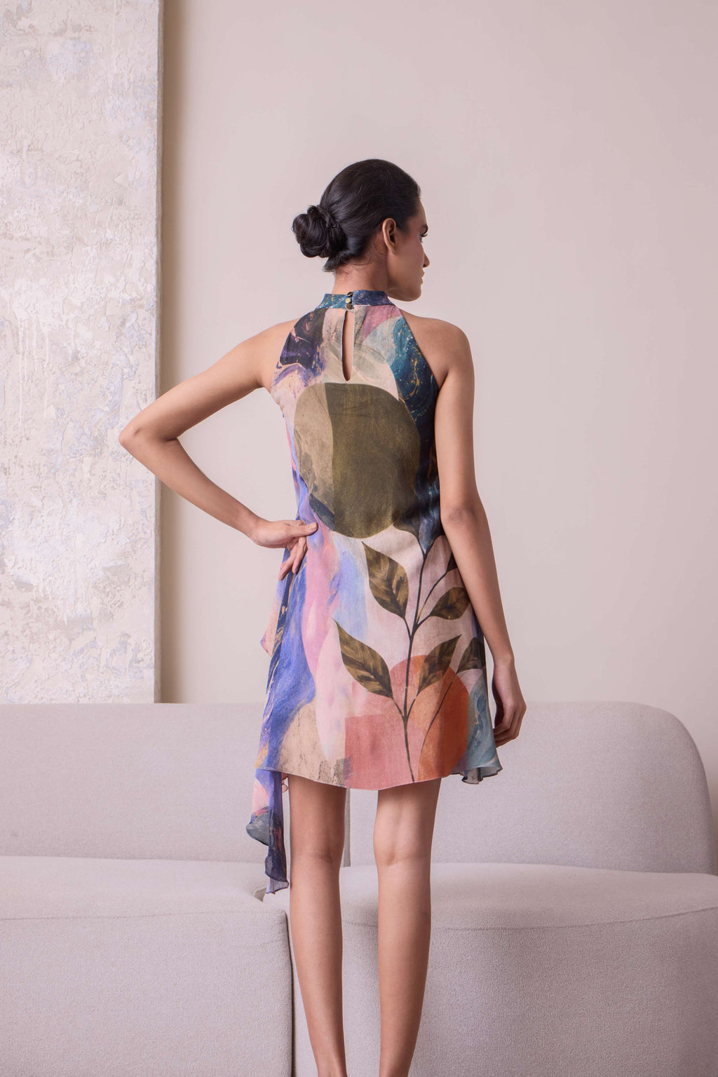 Simor Solistice High Neck Tiered Cascade Dress in flowing fabric with a high neckline and layered cascading design.