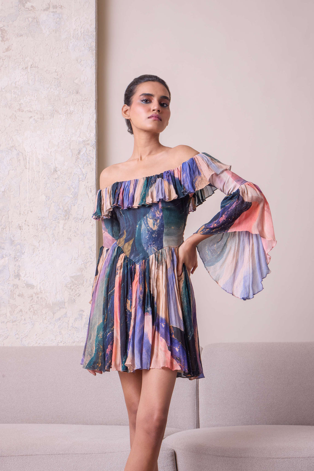 Simor cosmic off-shoulder bell-sleeve short dress displayed on a mannequin with a flowy, stylish design and vibrant pattern.