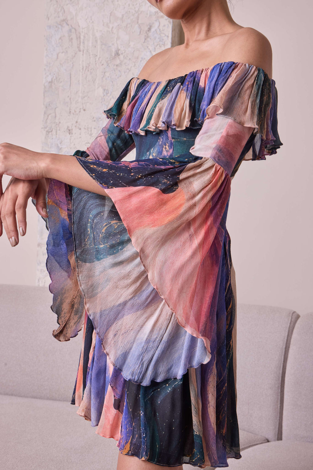 Simor cosmic off-shoulder bell-sleeve short dress displayed on a hanger, featuring a stylish, vibrant design and trendy silhouette.