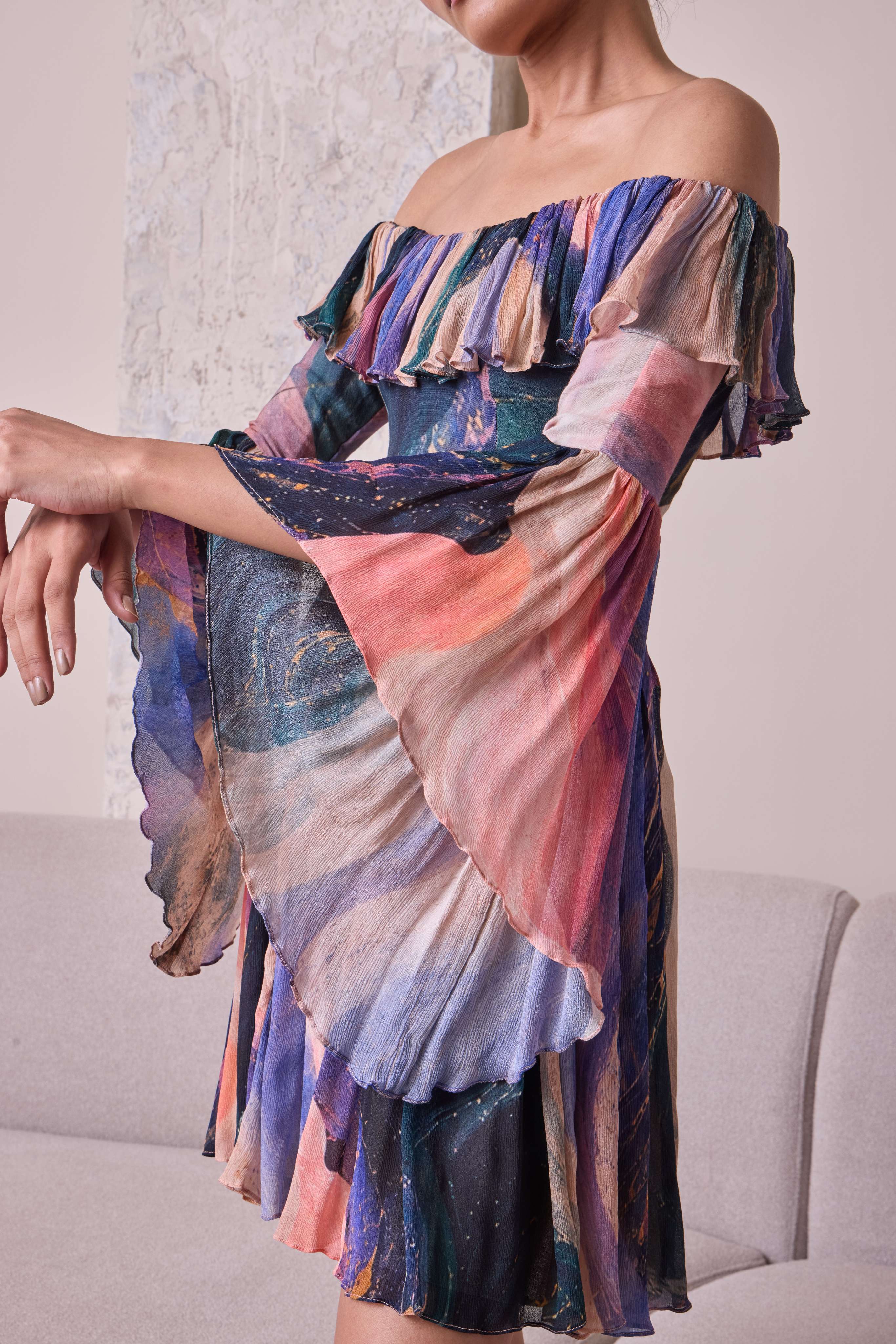 Simor cosmic off-shoulder bell-sleeve short dress displayed on a hanger, featuring a stylish, vibrant design and trendy silhouette.