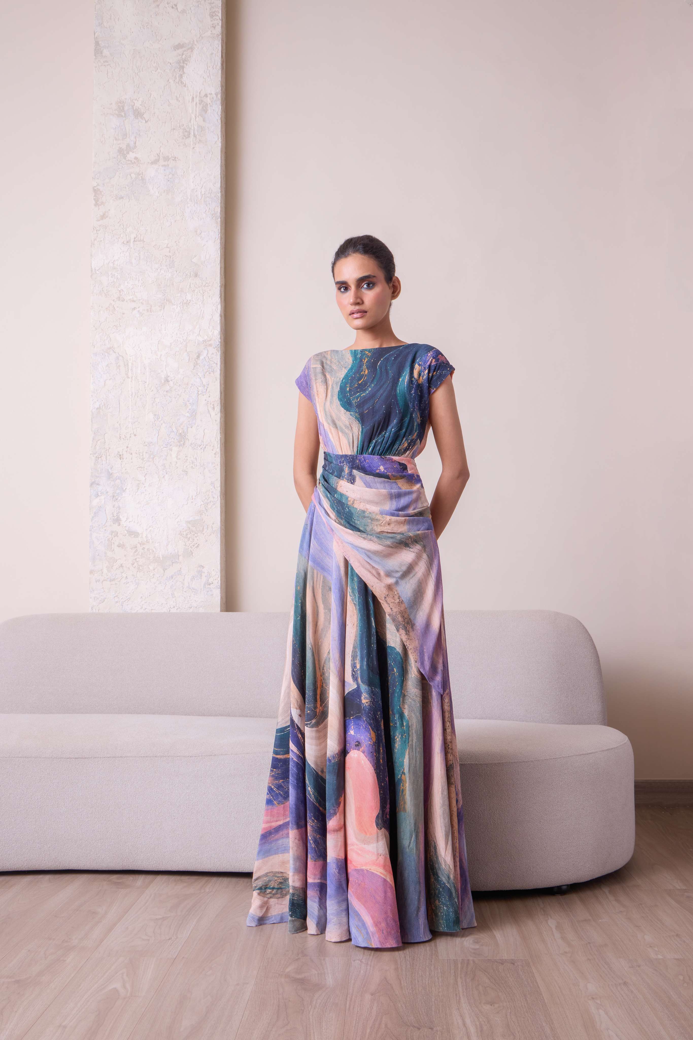 Celestial waist-draped gown by Simor featuring flowing fabric and elegant design, perfect for formal occasions.