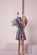 Cosmic off-shoulder bell-sleeve short dress by Simor, featuring a stylish design with flowing sleeves and a fitted bodice.