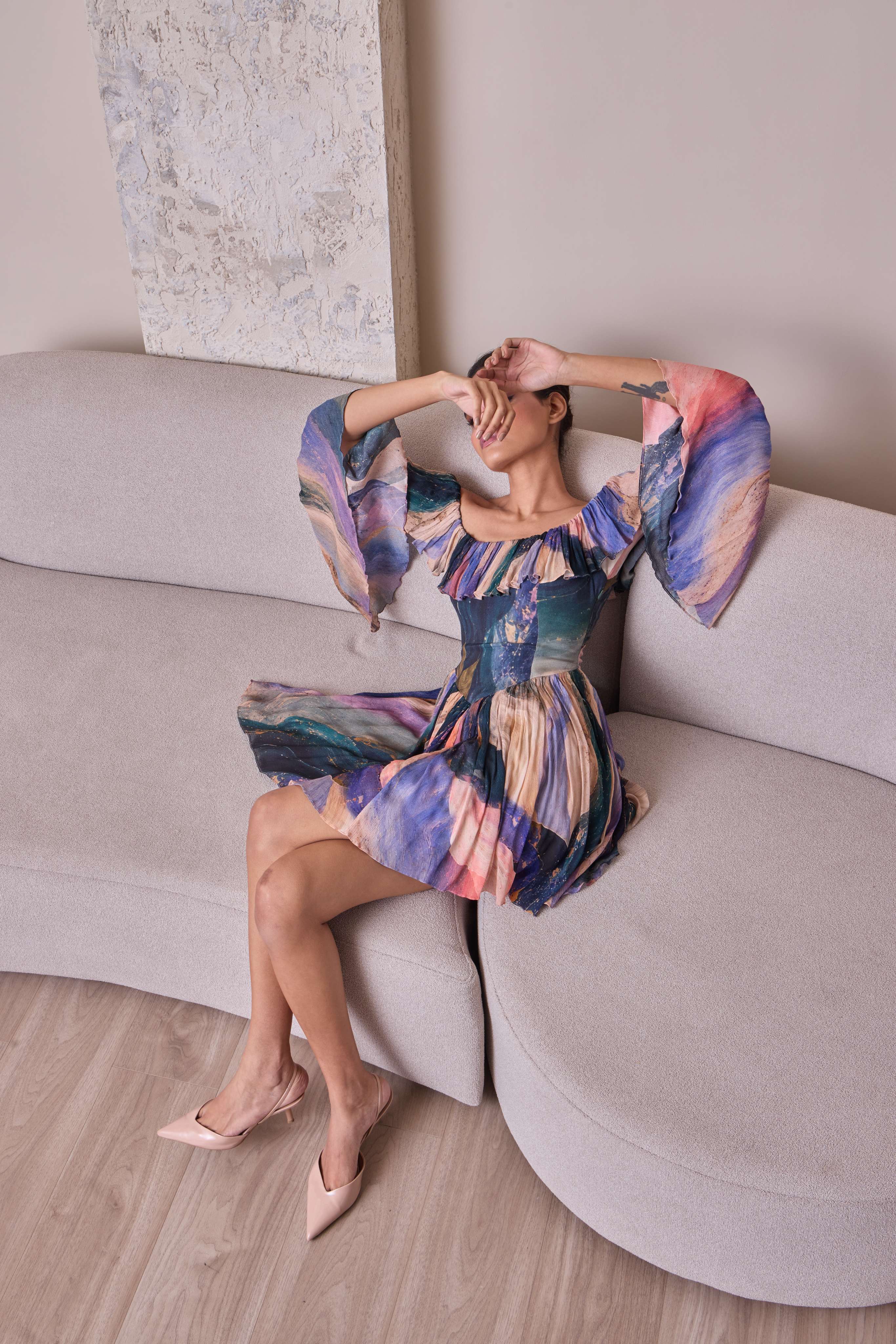 Simor cosmic off-shoulder bell-sleeve short dress displayed on a hanger, showcasing its stylish neckline and sleeve design.